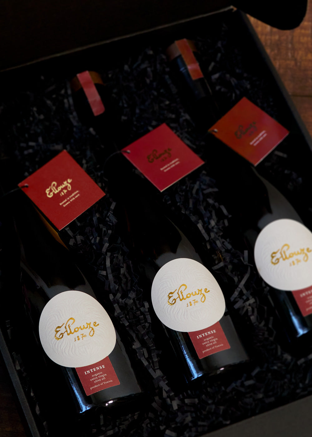 Three bottles of Intense Organic Extra Virgin Olive Oil 500ml elegantly packaged together, showcasing premium quality and design for olive oil enthusiasts.