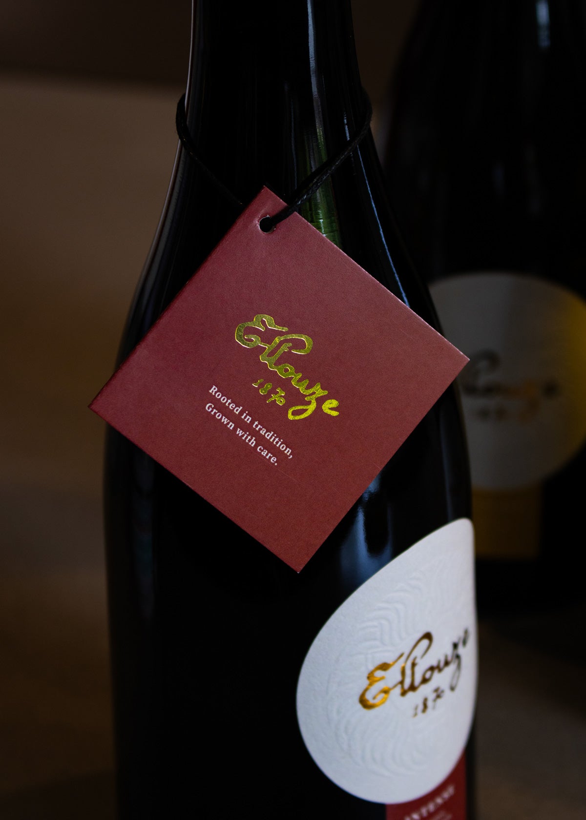 Close-up of Intense Organic Extra Virgin Olive Oil 500ml showcasing the Ellouze 1870 logo and label design, emphasizing quality and heritage.